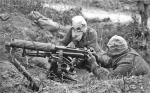 Vickers machine gun crew wearing gas mask (Wikipedia)